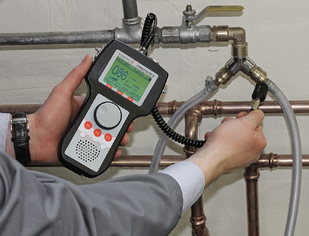 Plumber testing pipes with electronic leak detection equipment in Fountain