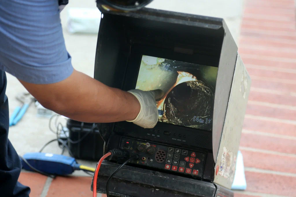 Technician viewing a drain inspection camera in Fountain